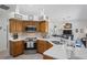 Spacious kitchen with modern appliances and convenient breakfast bar overlooks the open-concept living area at 12446 Quail Ridge Dr, Spring Hill, FL 34610