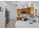 Well-equipped kitchen features stainless steel appliances, modern backsplash, and quartz countertops at 12446 Quail Ridge Dr, Spring Hill, FL 34610