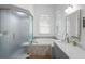 Modern main bathroom featuring shower, soaking tub, double sinks, and plenty of natural light at 12446 Quail Ridge Dr, Spring Hill, FL 34610