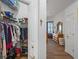 Spacious walk-in closet with ample shelving and hanging space, leading to main bedroom at 12446 Quail Ridge Dr, Spring Hill, FL 34610