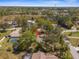 Aerial shot shows the home is conveniently located in a well-wooded residential area at 1267 Meredith Dr, Spring Hill, FL 34608
