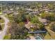 High-angle view shows the property's layout and its proximity to neighboring homes and fenced yard at 1267 Meredith Dr, Spring Hill, FL 34608