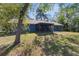 The beautiful home features an outdoor, screened-in patio and spacious backyard at 1267 Meredith Dr, Spring Hill, FL 34608