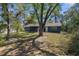 The exterior of the home features a screened-in patio and nice backyard at 1267 Meredith Dr, Spring Hill, FL 34608