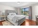 This bedroom features neutral walls and wood floors at 1267 Meredith Dr, Spring Hill, FL 34608