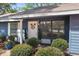 Inviting front porch with decorative plants and wreath offers a warm welcome at 1267 Meredith Dr, Spring Hill, FL 34608