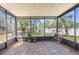 Screened in patio with red brick floor and nice backyard view at 1267 Meredith Dr, Spring Hill, FL 34608