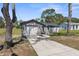 Lovely home with well-maintained lawn, garage, and stylish stone accents by the front door at 1283 Coble Rd, Spring Hill, FL 34608