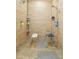 Accessible shower area with safety bars and built-in seats, ensuring comfort and convenience at 1353 Spring Lake Hwy, Brooksville, FL 34602