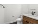 Contemporary half bathroom with a modern toilet, sleek vanity, and fixtures for a clean, minimalist design at 16043 Penn State Rd, Weeki Wachee, FL 34614