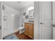 Bright bathroom with a walk-in shower and a vanity at 16386 Heron Hills Dr, Spring Hill, FL 34610