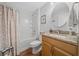Bright bathroom features granite countertop vanity and shower-tub combination offering a comfortable and stylish space at 16386 Heron Hills Dr, Spring Hill, FL 34610