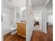 Bathroom with granite countertop vanity, tub-shower, and access to the bedroom at 16386 Heron Hills Dr, Spring Hill, FL 34610