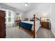 Bedroom featuring wood-frame bed, plush carpet, and abundant natural light for a peaceful and inviting retreat at 16386 Heron Hills Dr, Spring Hill, FL 34610