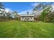 Charming detached dwelling with a metal roof nestled on a lush green lawn at 16386 Heron Hills Dr, Spring Hill, FL 34610