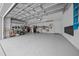 Well-organized three-car garage with an epoxy floor, ample storage and a utility sink at 16386 Heron Hills Dr, Spring Hill, FL 34610