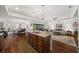 Spacious kitchen with a large island, open to the living and dining areas for easy entertaining at 16386 Heron Hills Dr, Spring Hill, FL 34610