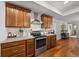 Well-appointed kitchen featuring stainless steel appliances, granite countertops, and ample cabinetry at 16386 Heron Hills Dr, Spring Hill, FL 34610