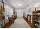 Charming living room featuring hardwood floors, stylish furniture, and decor accents at 16386 Heron Hills Dr, Spring Hill, FL 34610
