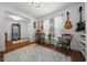 Cozy sitting area with hardwood floors, chairs, decor, and natural light from the window at 16386 Heron Hills Dr, Spring Hill, FL 34610