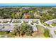 Aerial view of townhomes in a wooded setting within a well-maintained community at 18045 Tarrington Pl, Hudson, FL 34667