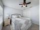 Inviting bedroom with a ceiling fan, carpeted floor, and a double door closet at 18045 Tarrington Pl, Hudson, FL 34667