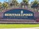 Entrance sign for Heritage Pines, an active 55+ country club living community at 18045 Tarrington Pl, Hudson, FL 34667