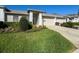 Well-maintained single-story home with a lush lawn and neat landscaping at 18045 Tarrington Pl, Hudson, FL 34667