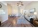 Open-concept living and dining area features hardwood floors and neutral decor at 18045 Tarrington Pl, Hudson, FL 34667