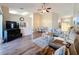 Comfortable living area offers a view of the dining space and hardwood flooring at 18045 Tarrington Pl, Hudson, FL 34667