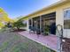Outdoor patio space with seating, a view of the backyard, and a serene setting at 18045 Tarrington Pl, Hudson, FL 34667