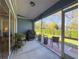 Screened-in patio features ample seating and outdoor views, perfect for relaxing at 18045 Tarrington Pl, Hudson, FL 34667