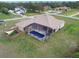 A beautiful screened pool is the highlight of this single Gathering home at 18317 Treehaven Dr, Hudson, FL 34667
