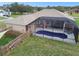 This single Gathering home has a pristine screened in pool in a large back yard at 18317 Treehaven Dr, Hudson, FL 34667