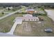 Spacious single-story home featuring a three car garage, a pool, and serene waterfront views at 18317 Treehaven Dr, Hudson, FL 34667