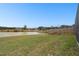 Serene backyard view with a wooden fence and water views at 18317 Treehaven Dr, Hudson, FL 34667