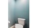 Powder room features a toilet and toilet paper holder at 18317 Treehaven Dr, Hudson, FL 34667