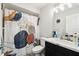 Bathroom showing a modern shower curtain and toilet at 18317 Treehaven Dr, Hudson, FL 34667