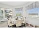 Bright breakfast nook with a view to the lanai and a table with seating for six people at 18317 Treehaven Dr, Hudson, FL 34667