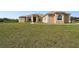 Single Gathering home with arched entryway, well manicured yard and attached garage at 18317 Treehaven Dr, Hudson, FL 34667