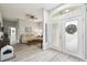 Bright entry foyer with hardwood floors and views to the living room at 18317 Treehaven Dr, Hudson, FL 34667