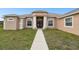 Charming front entrance features a large porch supported by columns, and a double-door entrance at 18317 Treehaven Dr, Hudson, FL 34667