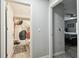 Hallway between a bathroom and a bedroom with hardwood floors at 18317 Treehaven Dr, Hudson, FL 34667