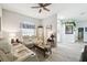 Inviting living room featuring hardwood floors, neutral paint, and modern furniture at 18317 Treehaven Dr, Hudson, FL 34667