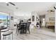 Spacious living room with hardwood floors connecting multiple rooms of the home at 18317 Treehaven Dr, Hudson, FL 34667