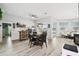 Open floor plan of a home featuring multiple living spaces and hardwood floors at 18317 Treehaven Dr, Hudson, FL 34667