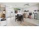 Inviting living room with hardwood floors, a ceiling fan, and views of the home's entry at 18317 Treehaven Dr, Hudson, FL 34667