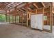 Large open barn interior with unfinished walls, concrete floor, and wooded support beams at 19263 Quiet Oak Ln, Brooksville, FL 34604