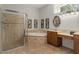 Elegant bathroom featuring a walk-in shower, garden tub, and dual vanities at 19263 Quiet Oak Ln, Brooksville, FL 34604