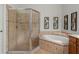 Primary bathroom featuring a glass shower, and soaking tub with stylish framed floral prints at 19263 Quiet Oak Ln, Brooksville, FL 34604